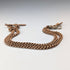 Antique British rolled gold double Albert chain with brass key fob